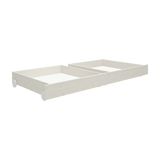 FLEXA WHITE drawers, pine with wheels, fit neatly under bed in child’s room; safe edges visible.