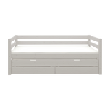 Cama individual FLEXA de la gama CLASSIC en madera gris, con cama extraíble, cajones de almacenamiento y barandilla de seguridad, sobre fondo liso.