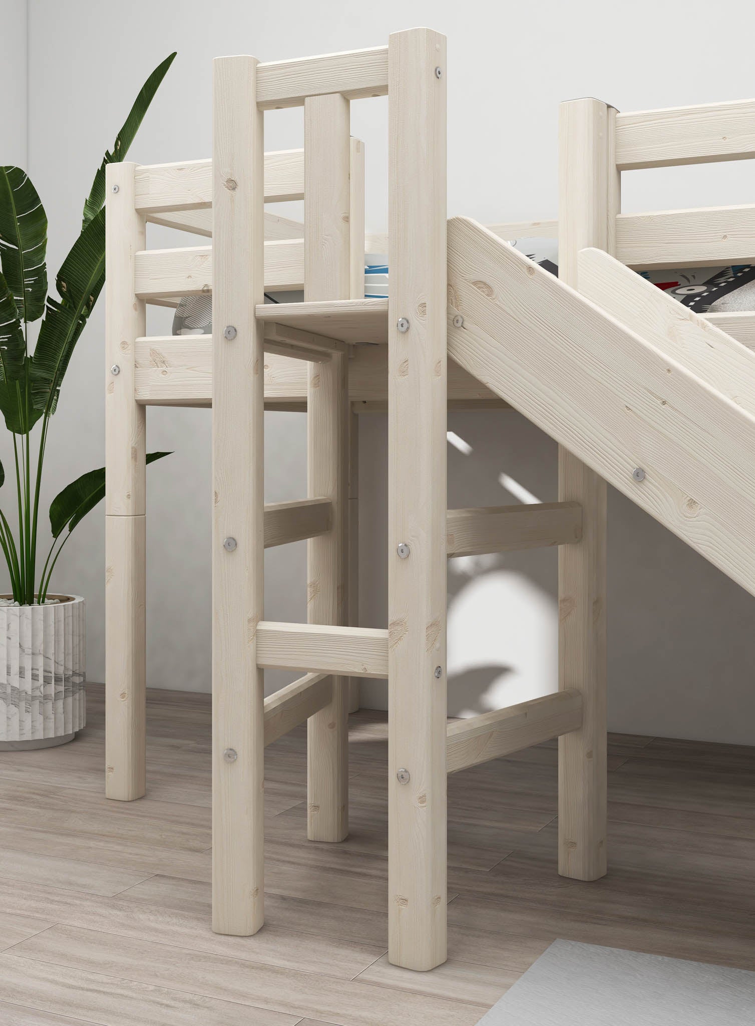 FLEXA white high bed with slide, short ladder, and safety rail from CLASSIC collection on wooden floor in child’s room.