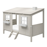 Estructura de casa FLEXA WHITE para camas individuales y camas altas con dos ventanas, escalera y techo inclinado, tal y como se muestra en una habitación infantil.
